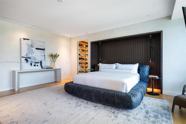 4701 N Meridian Ave Unit 603, Miami Beach, FL 33140 - bedroom with baseboards and wood finished floors