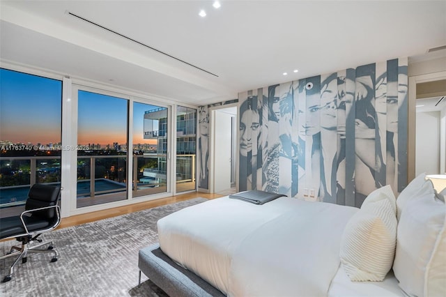 4701 N Meridian Ave Unit 603, Miami Beach, FL 33140 - bedroom with a city view, expansive windows, wood finished floors, recessed lighting, and access to exterior