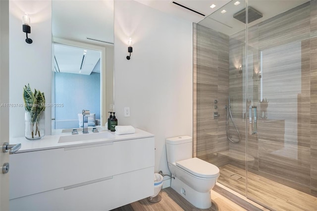4701 N Meridian Ave Unit 603, Miami Beach, FL 33140 - full bath featuring vanity, toilet, wood finished floors, and a stall shower
