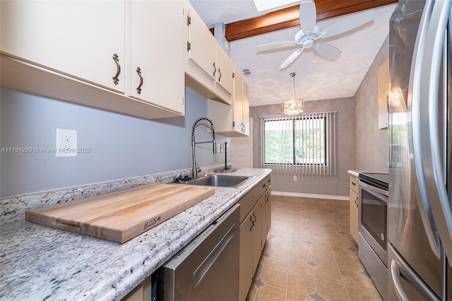 kitchen with a sink, white cabinetry, appliances with stainless steel finishes, light countertops, and vaulted ceiling with beams