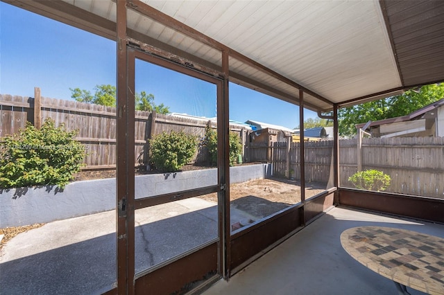 unfurnished sunroom featuring plenty of natural light