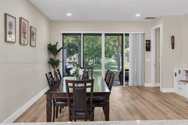 dining area with visible vents, recessed lighting, light wood-type flooring, and baseboards