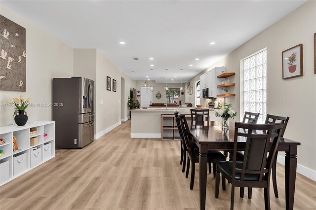 84 Belle Grove Ln, Royal Palm Beach, FL 33411 - dining room featuring light wood-style floors, recessed lighting, and baseboards
