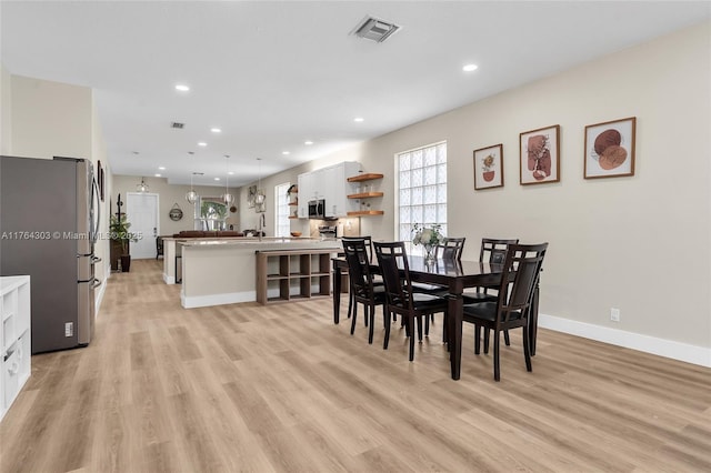 dining area with recessed lighting, visible vents, baseboards, and light wood-style floors