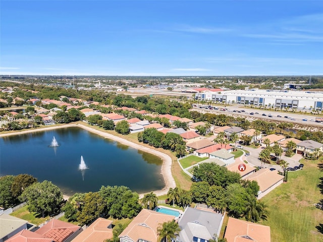 birds eye view of property with a residential view and a water view