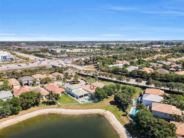 birds eye view of property with a residential view and a water view