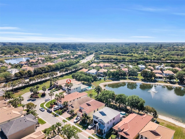 drone / aerial view featuring a residential view and a water view