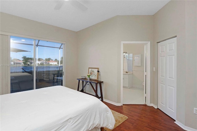 bedroom featuring ensuite bathroom, access to outside, dark wood finished floors, baseboards, and ceiling fan