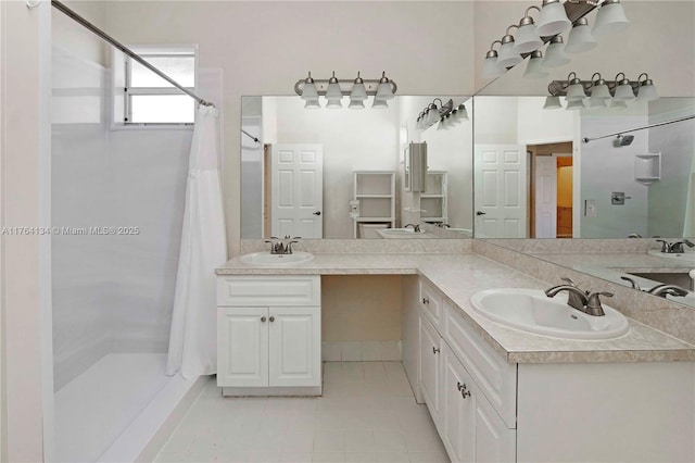 full bathroom with tile patterned floors, a shower with curtain, and vanity