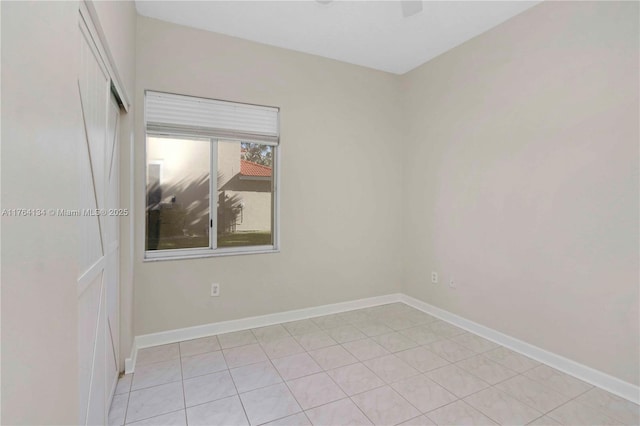 empty room featuring baseboards