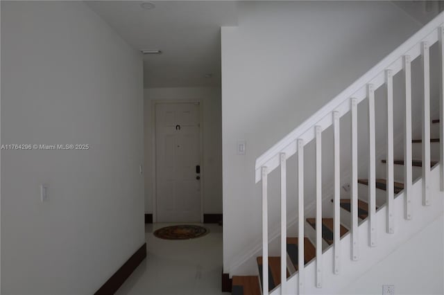 stairway with baseboards