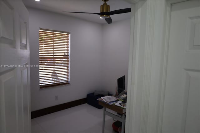 office with baseboards and ceiling fan