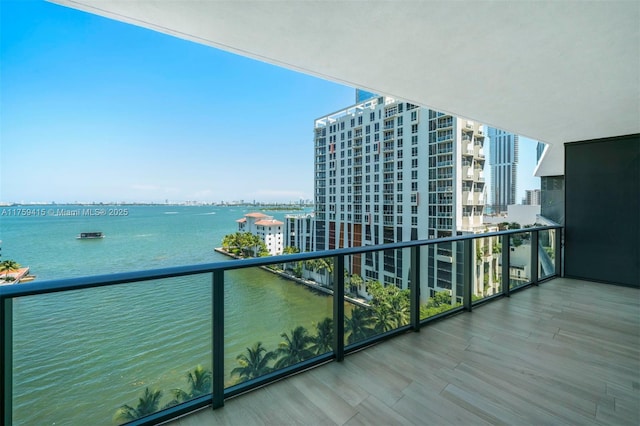 balcony featuring a water view