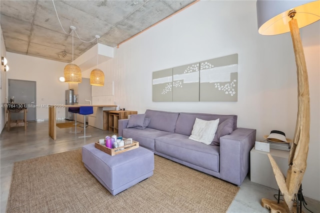 living room featuring finished concrete floors