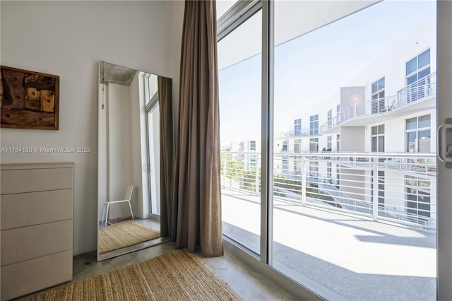 spare room with unfinished concrete flooring