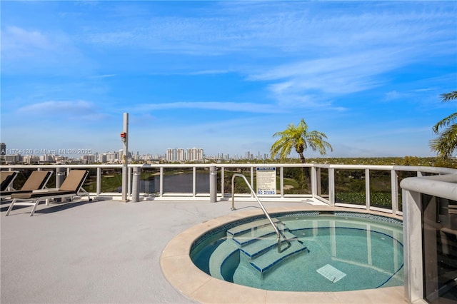 view of pool featuring a community hot tub and a view of city