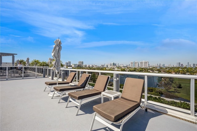 view of patio / terrace with a city view and a balcony