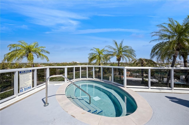 view of pool featuring a hot tub