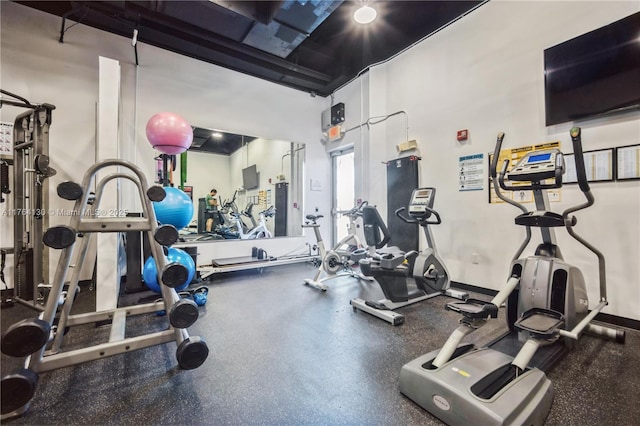 exercise room with baseboards