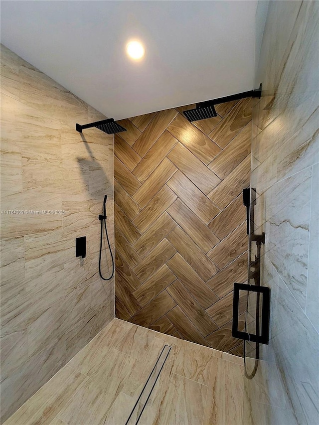 full bathroom with tiled shower