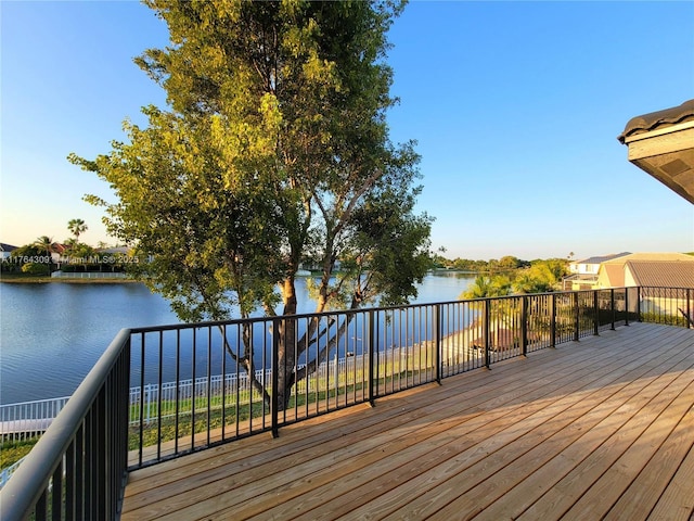 wooden deck with a water view