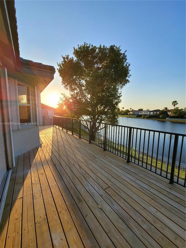 wooden deck with a water view