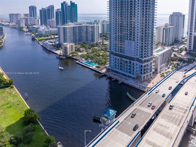 aerial view featuring a city view and a water view