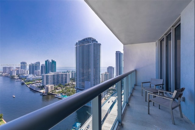 balcony with a view of city and a water view