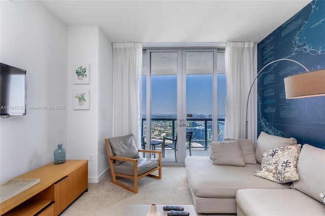 living area with expansive windows, light carpet, baseboards, and an accent wall