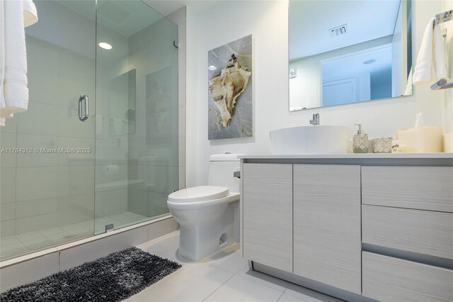 2602 E Hallandale Beach Blvd Unit R3004, Hallandale Beach, FL 33009 - bathroom featuring toilet, vanity, a shower stall, and tile patterned flooring
