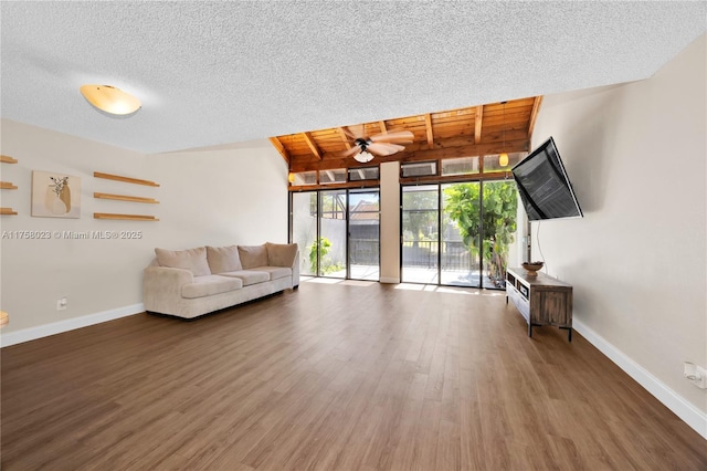 unfurnished living room with baseboards, wooden ceiling, wood finished floors, a textured ceiling, and a ceiling fan