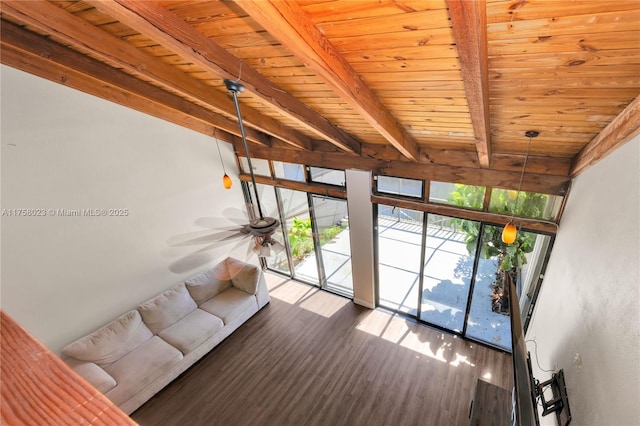 unfurnished sunroom featuring beam ceiling, wood ceiling, and ceiling fan