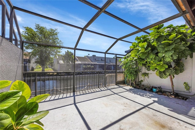 view of patio with a lanai and a residential view