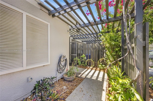 view of patio / terrace with fence and a pergola