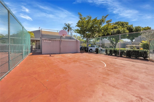 view of sport court featuring community basketball court and fence