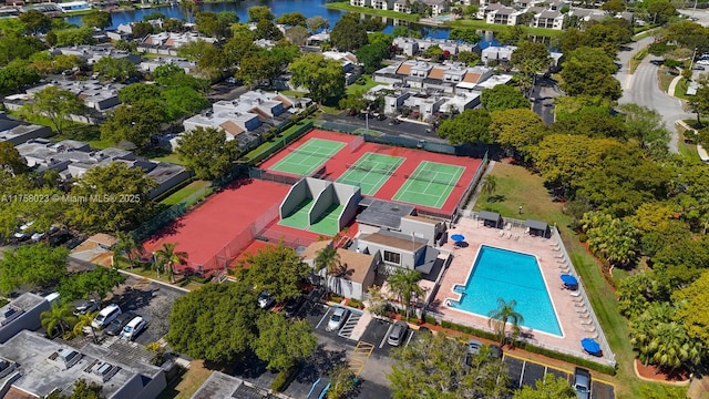 drone / aerial view with a water view and a residential view