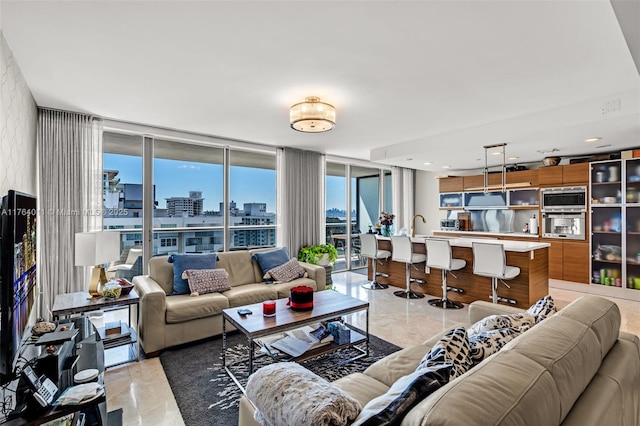 living room featuring a city view and floor to ceiling windows