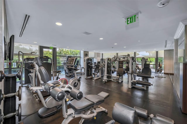 workout area with recessed lighting and floor to ceiling windows