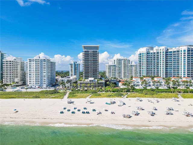 drone / aerial view with a view of the beach, a view of city, and a water view