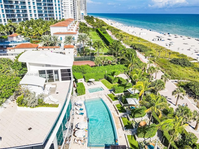 aerial view featuring a water view and a view of the beach