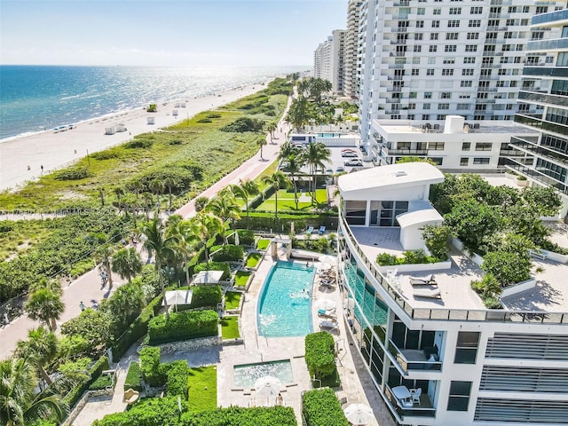 drone / aerial view with a beach view and a water view