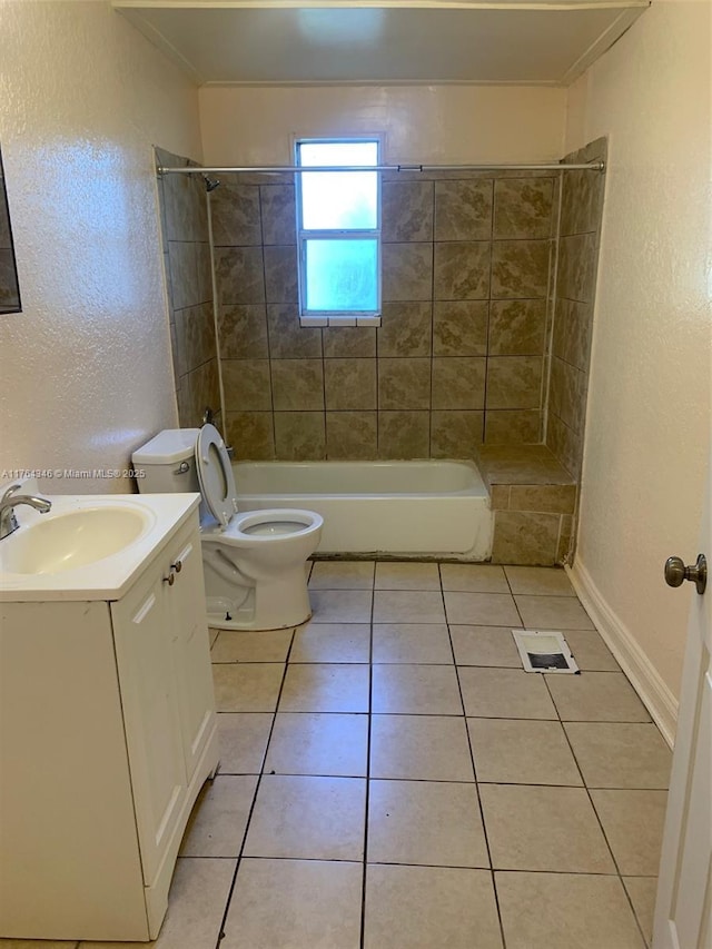 full bathroom featuring toilet, shower / bathing tub combination, tile patterned flooring, vanity, and a textured wall