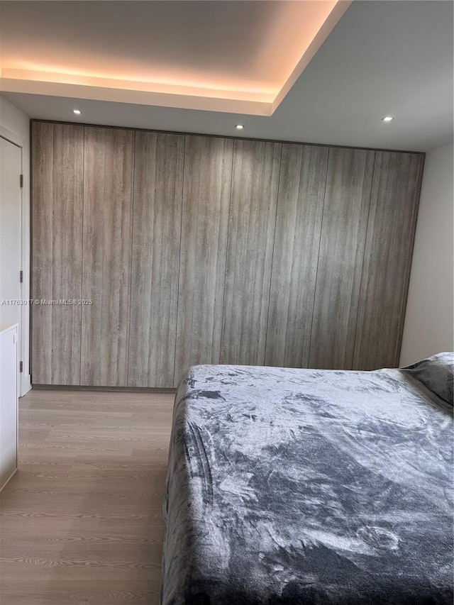 bedroom featuring recessed lighting and wood finished floors