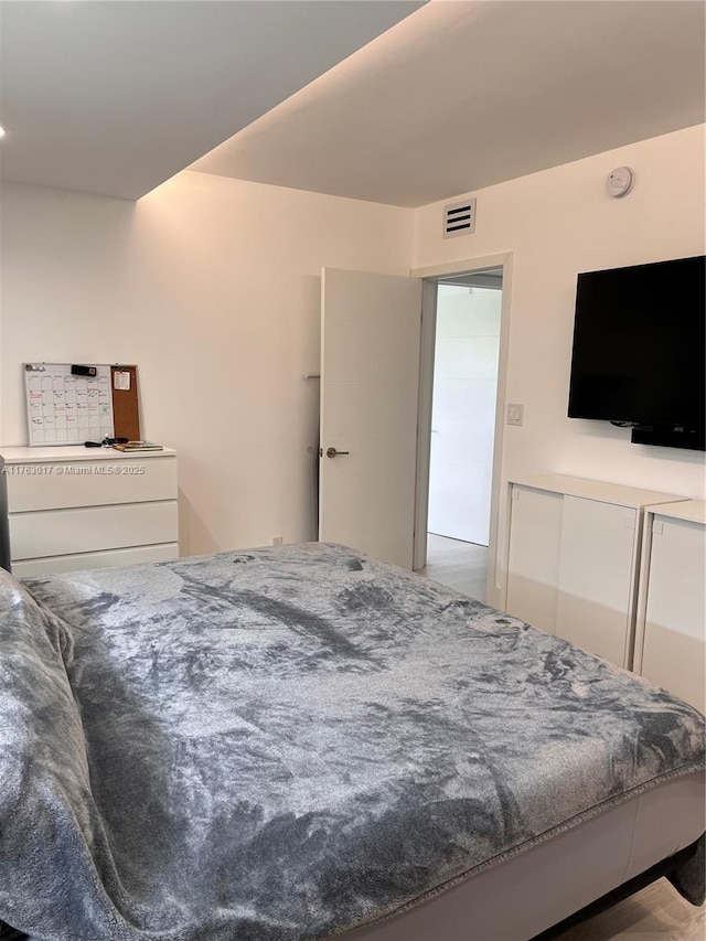 bedroom featuring visible vents