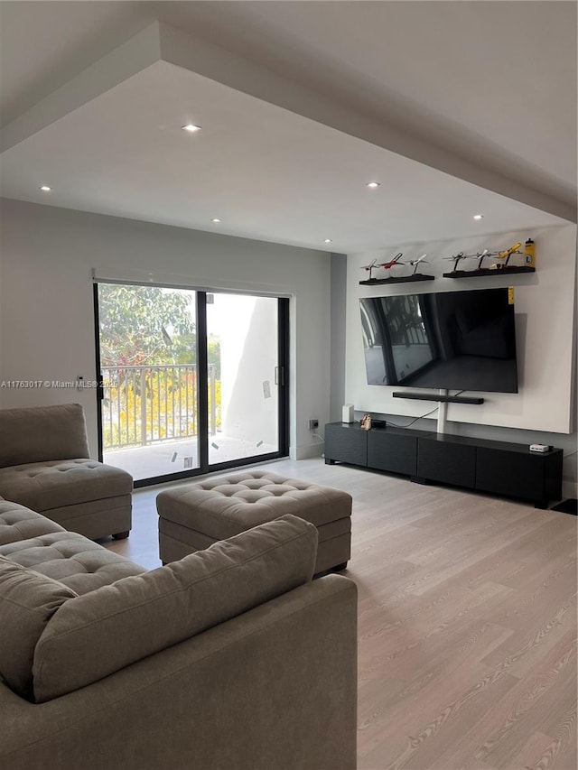 living room with recessed lighting and wood finished floors