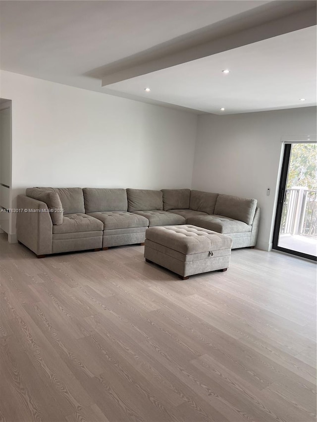 unfurnished living room with recessed lighting and wood finished floors