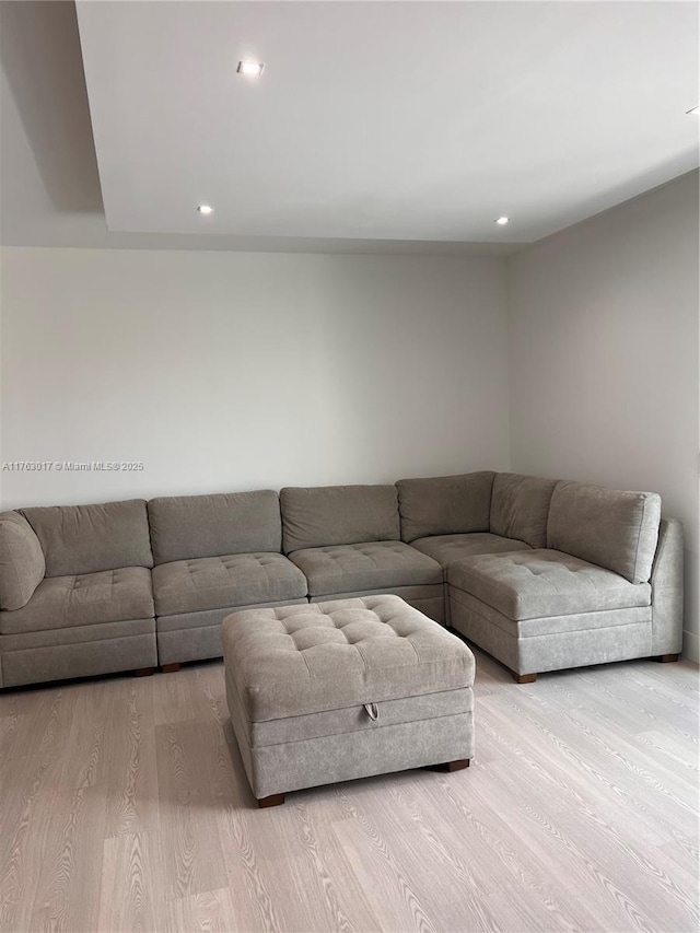 living room featuring light wood finished floors and recessed lighting