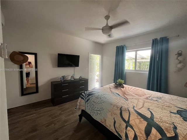 bedroom featuring dark wood-style floors and a ceiling fan