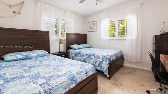 bedroom featuring lofted ceiling, baseboards, and ceiling fan