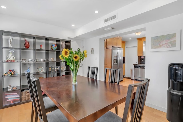 dining area featuring recessed lighting, light wood-style floors, and visible vents